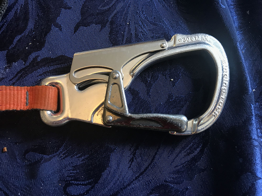 A via ferrata carabiner. It locks unless you squeeze both sides.